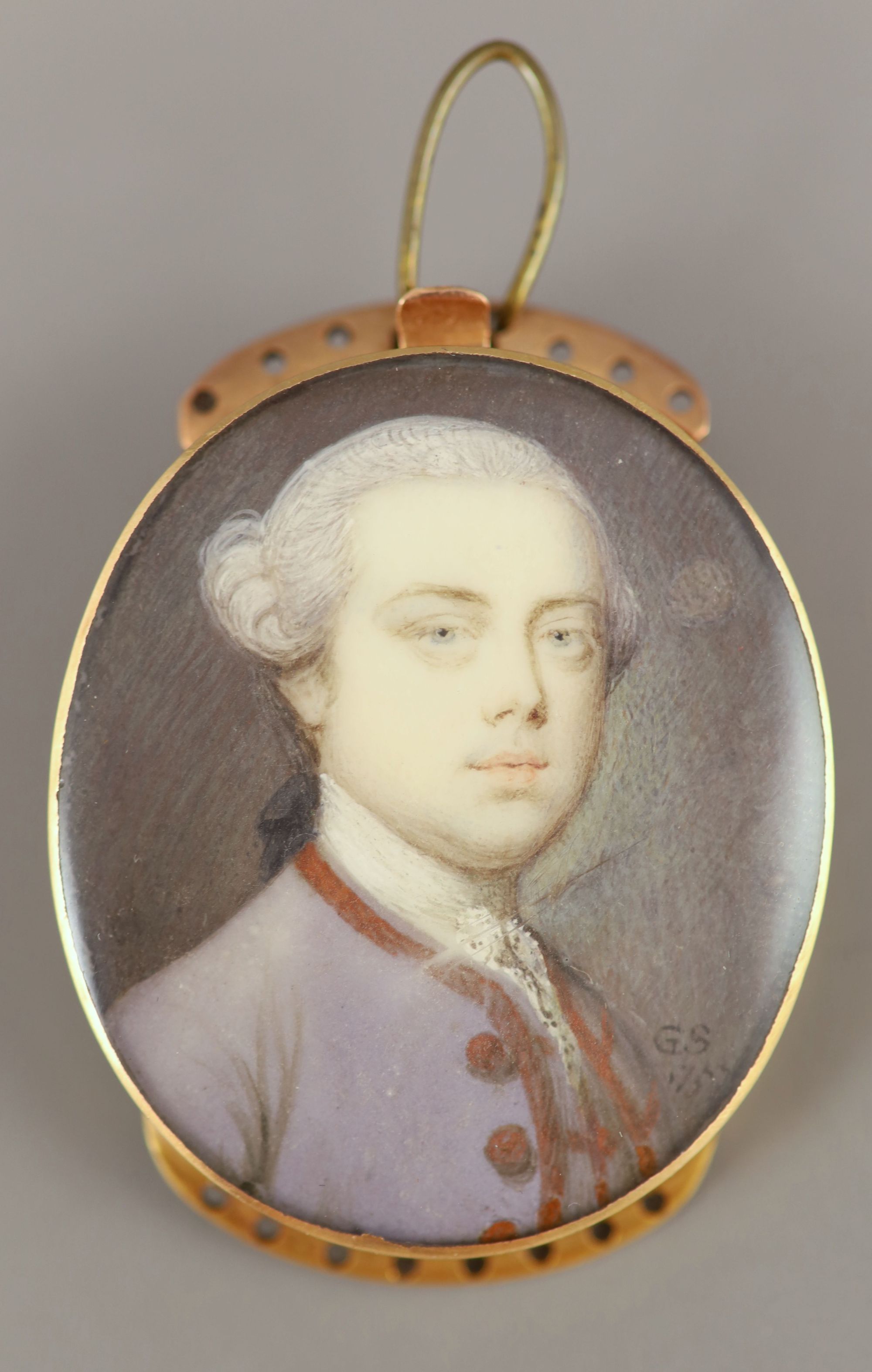 Gervase Spencer (d.1763) Portrait miniature of a gentleman wearing a lilac coat 1.25 x 1in. gold framed.